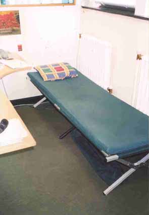 camp bed in office