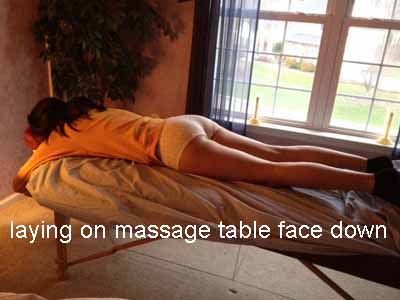 laying on massage table face down